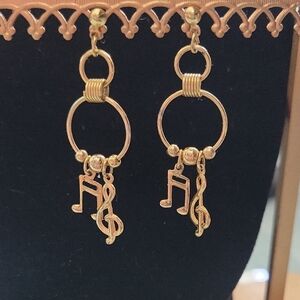 Music Note And Treble Clef Earrings In A Gold Tone Metal